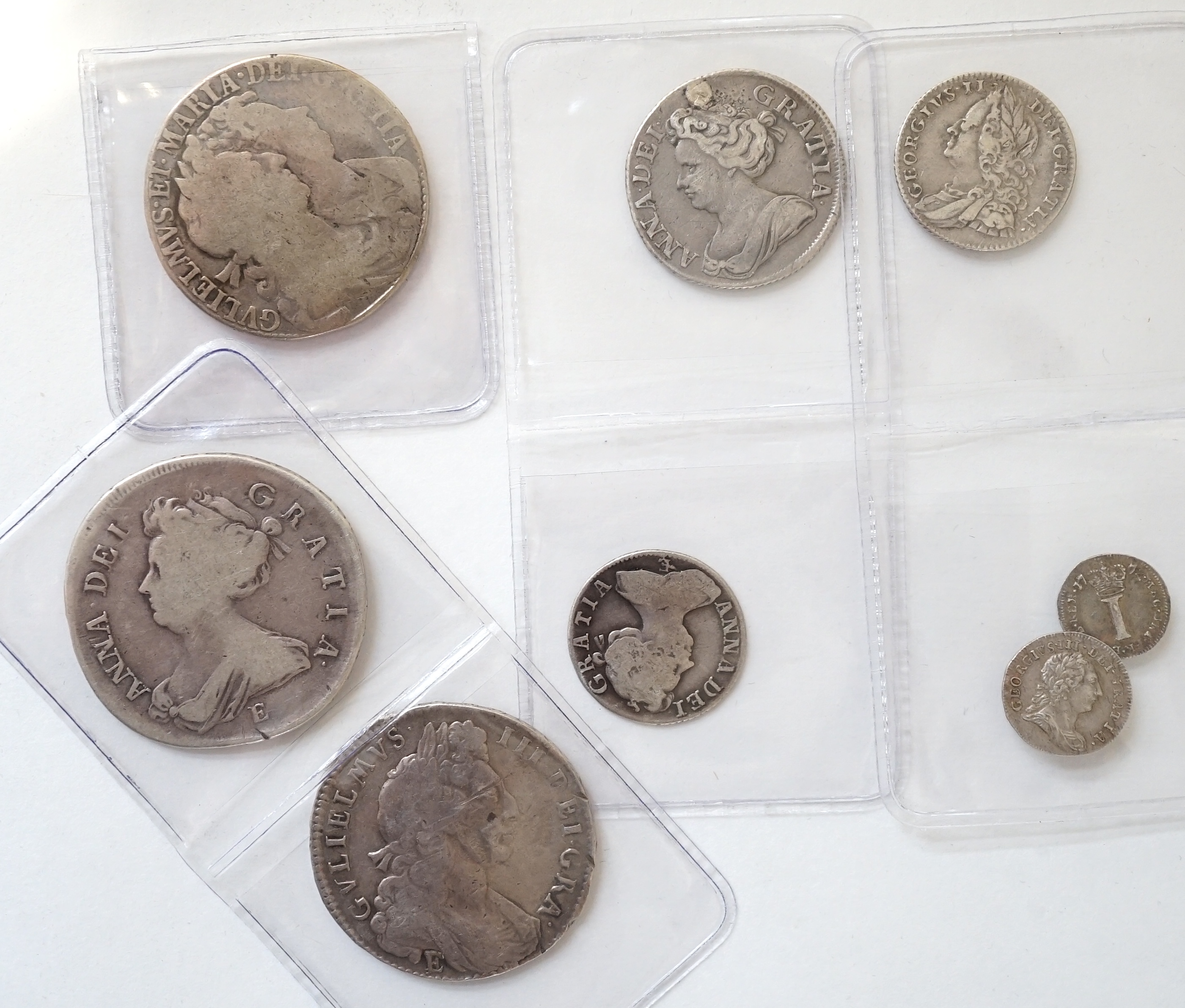 British milled silver coins, Stuart to Georgian, comprising William and Mary and halfcrown, 1689, William III halfcrown, 1697E, Anne halfcrown, 1707E, shilling, 1711, plugged hole otherwise fine, sixpence, 1708E, George